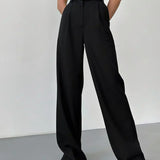 Pantaloni negri cu talie înaltă și croială largă